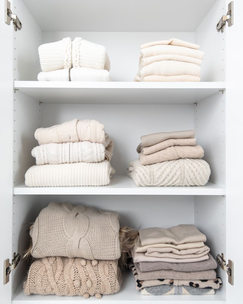 Folding board used for perfect sweater folds as part of fall organization tips