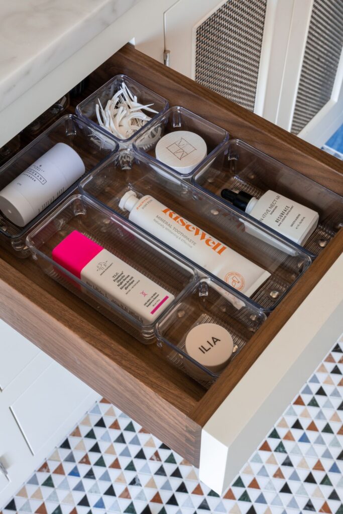 Guest room essentials basket with toiletries, extra toiletries, and charging station for convenience.